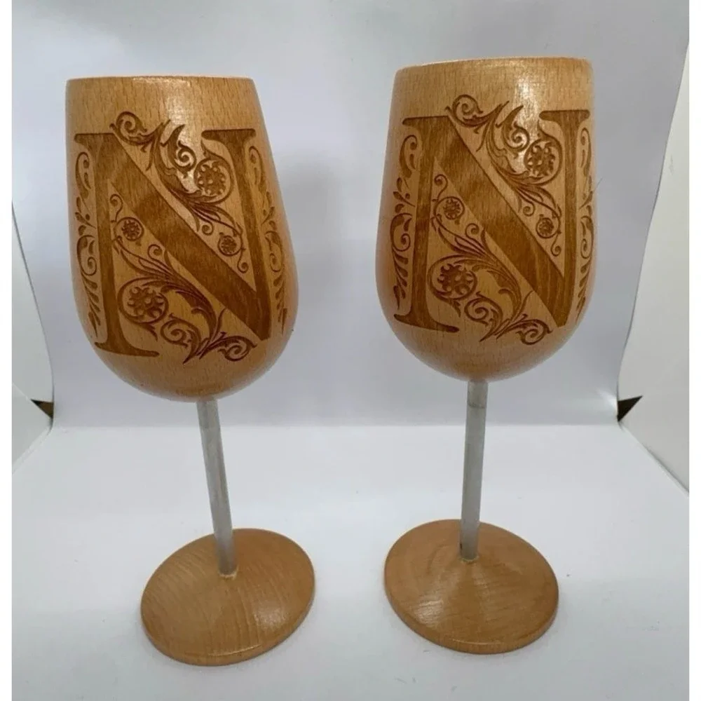 Two wooden monogrammed 'N' wine glasses. NEW.
